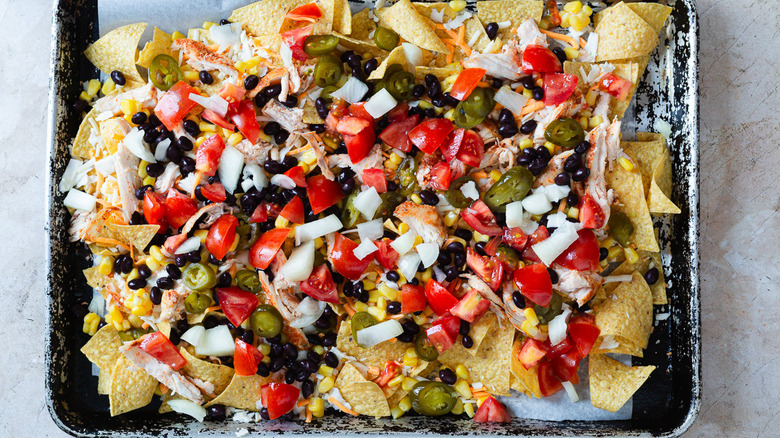 nachos topped with fresh toppings
