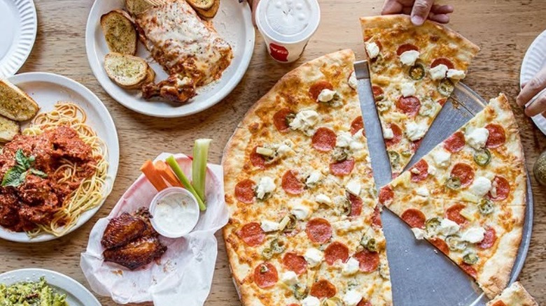 Spread of pizza and pasta at Pizzeria Luigi