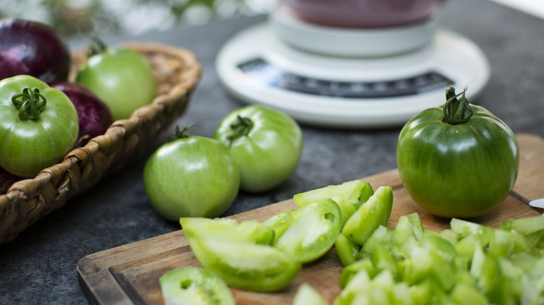 Green tomatoes on counter