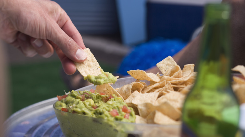 Dipping chip in guacamole