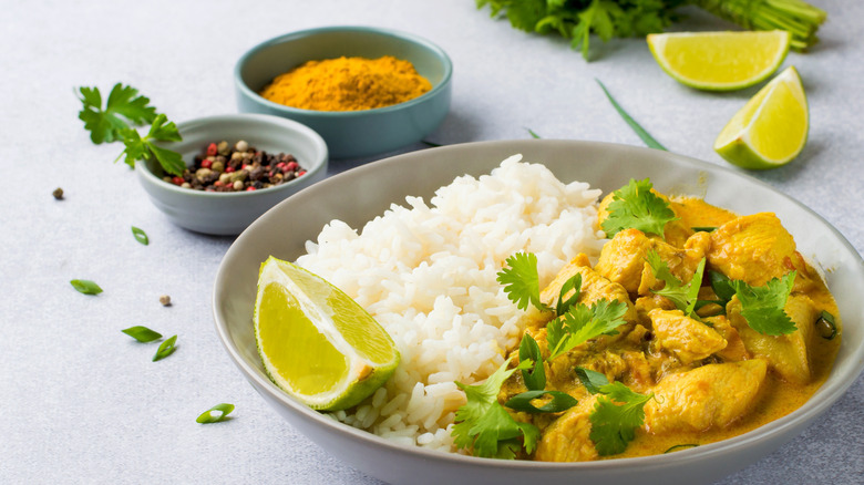 chicken and white rice in a white bowl