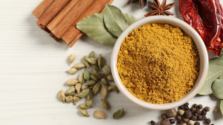 Curry powder surrounded by spices