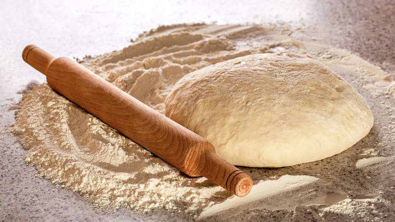 Pizza dough and rolling pin