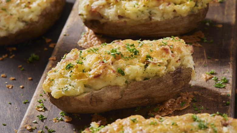 Twice baked potatoes on a wooden plank