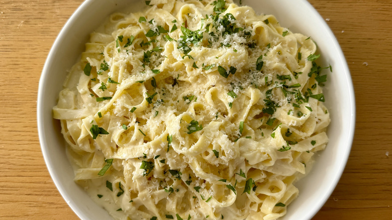 Fettuccine Alfredo on plate with garnishes