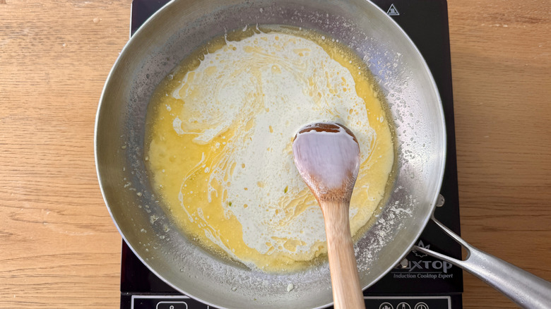 Cream and butter in pan