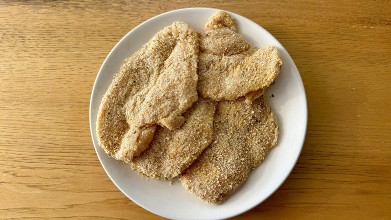 Breaded chicken breasts on plate