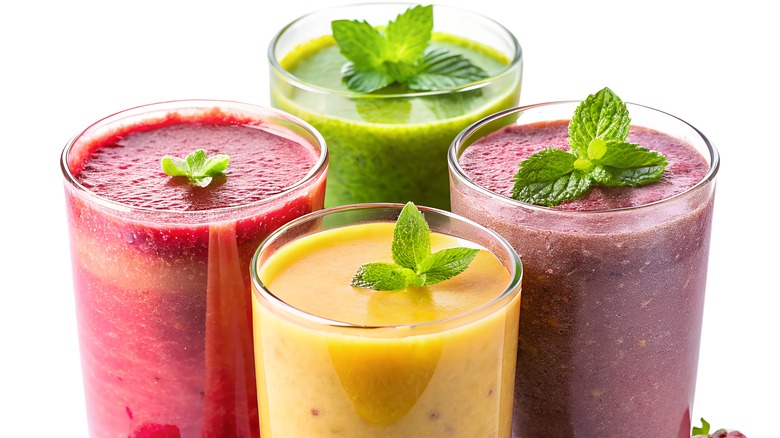 Glasses of various fruit smoothies 