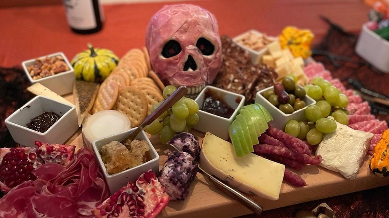 Meat skull on charcuterie board