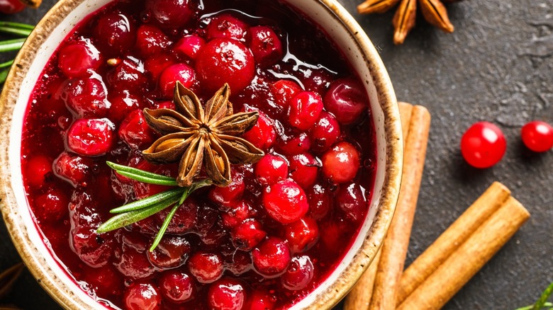 Garnish cranberry mostarda with cinnamon, rosemary, and star anise