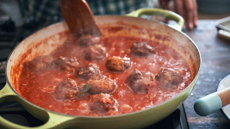 Tomato sauce meat ball cooking