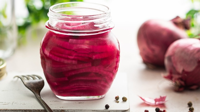 Pickled red onions in a glass jar