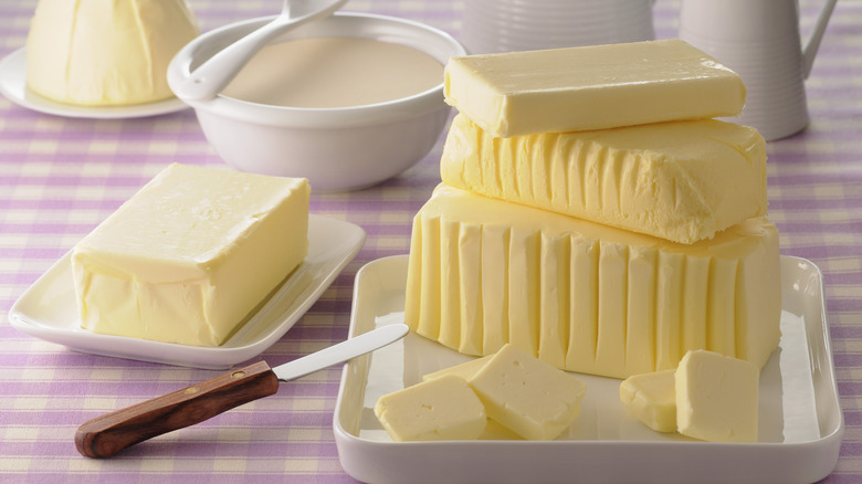 Blocks of butter on tablecloth