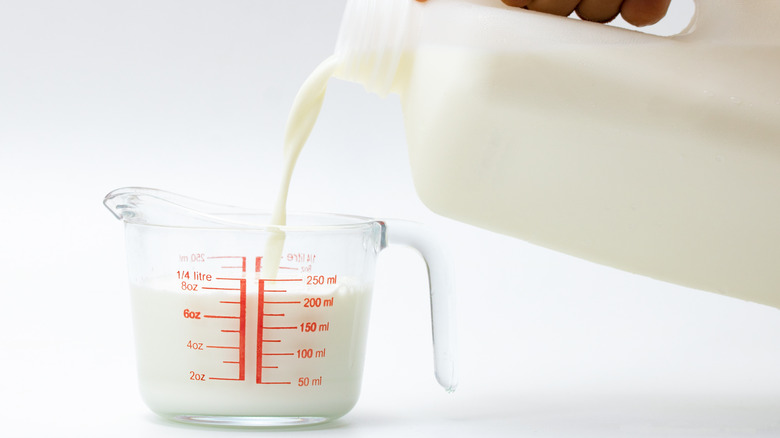 Milk poured into measuring cup