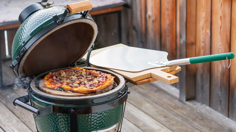 pizza cooking on grill