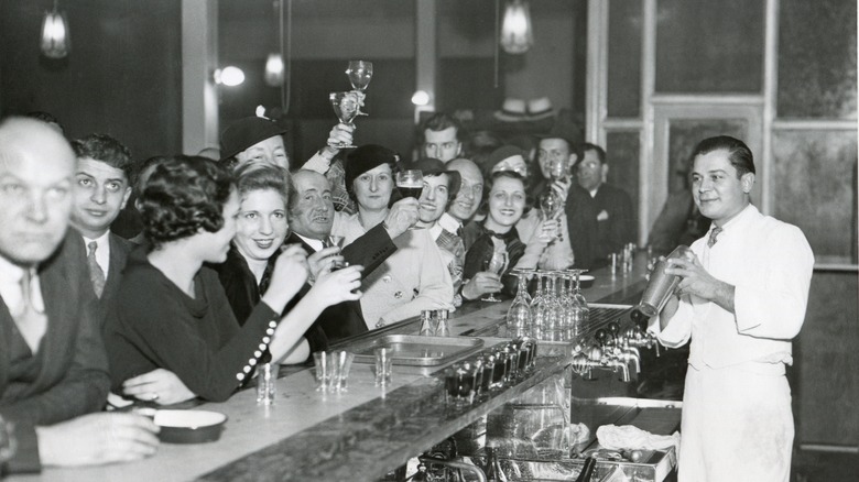 patrons at a bar 1930s 