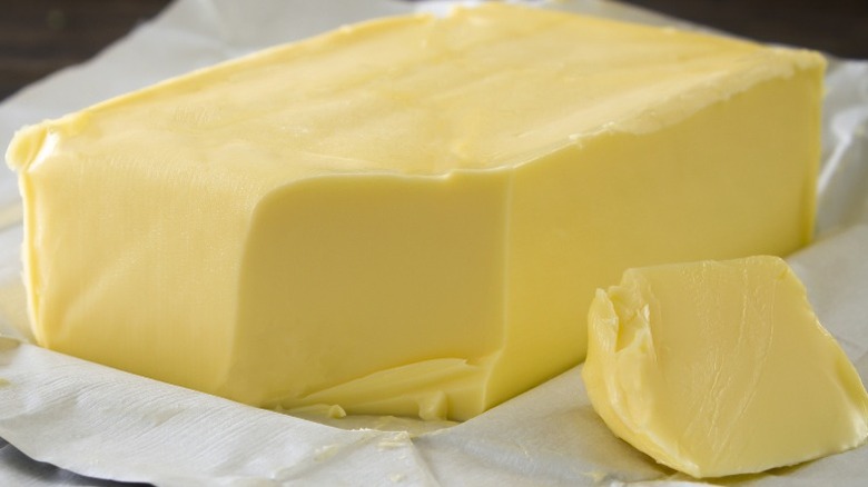 A block of European butter on foil