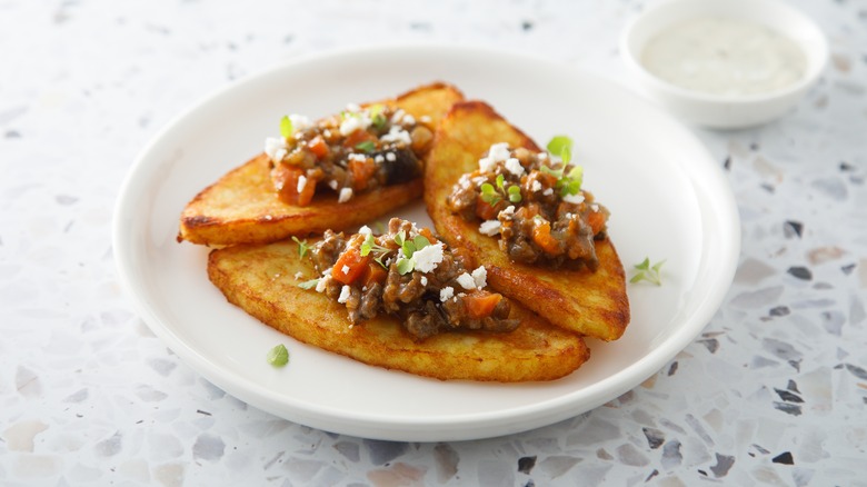 Hash browns topped with chili