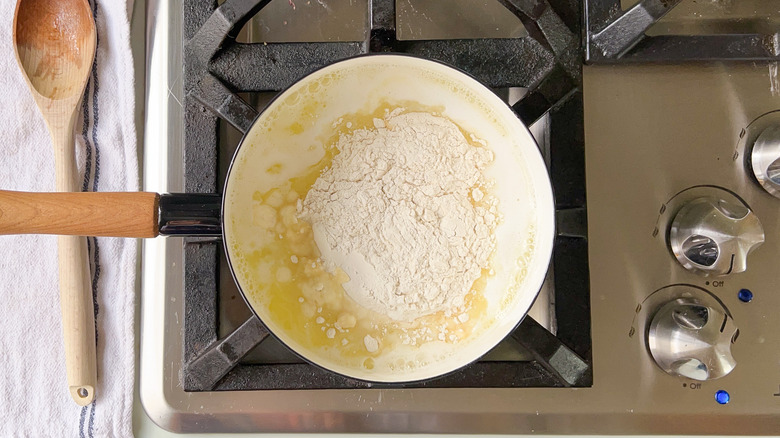 Flour, butter and water in saucepan on stove
