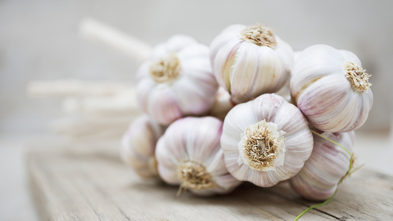 Bulbs of garlic on table