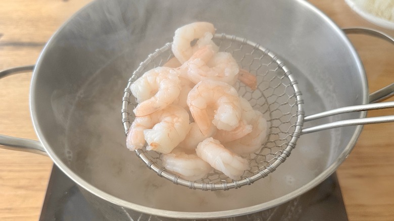 cooked shrimp in spider strainer