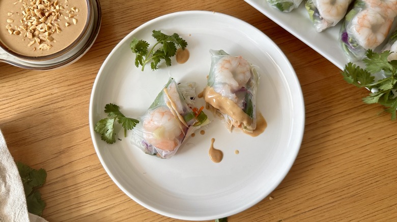 halved shrimp roll with sauce