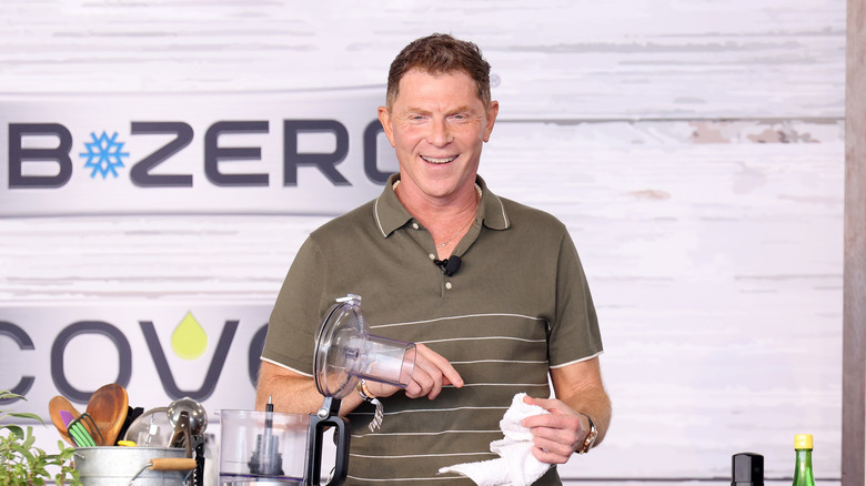 Celebrity chef Bobby Flay smiling at a live cooking demonstration.