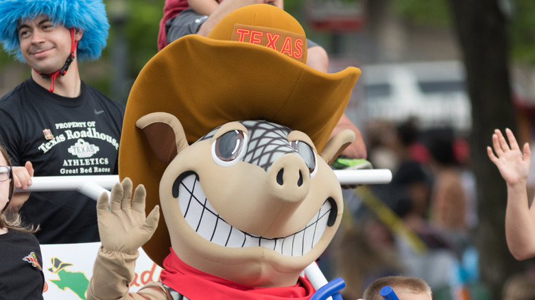 Texas Roadhouse mascot Andy Armadillo waving in a parade