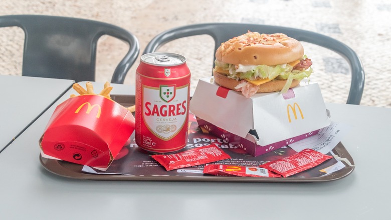 McDonald's burger, fries, and Sagres beer on a tray