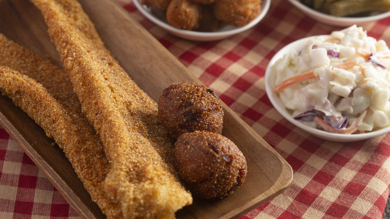 Fried fish with hush puppies and coleslaw