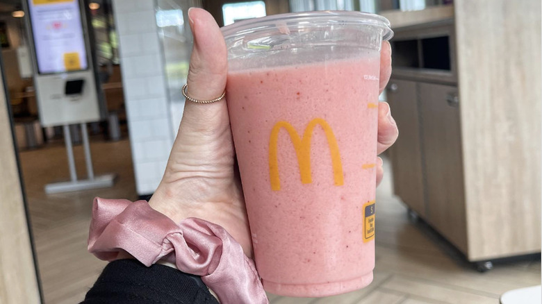 Hand holding McDonald's smoothie