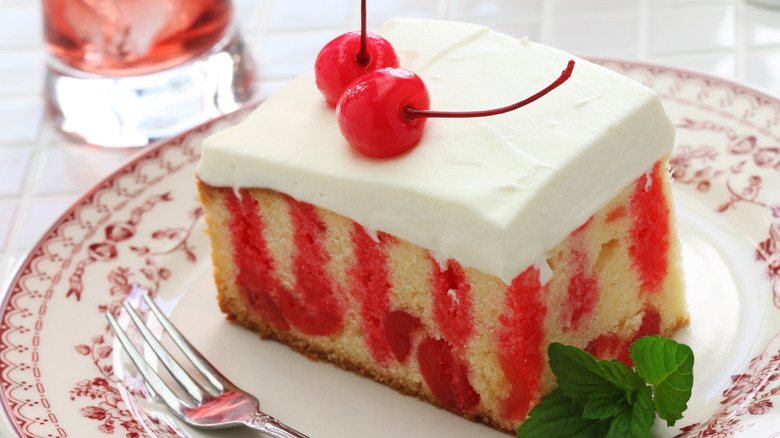 cherry poke cake on a plate