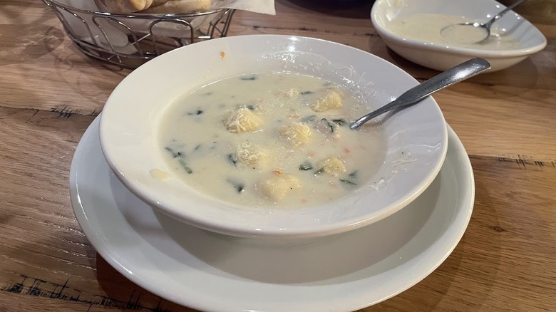A bowl of chicken and gnocchi soup