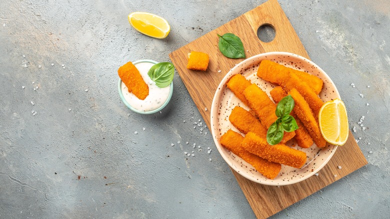 Fish sticks on wooden board