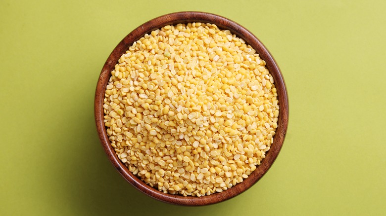 A heaping bowl of dried, yellow moong dal