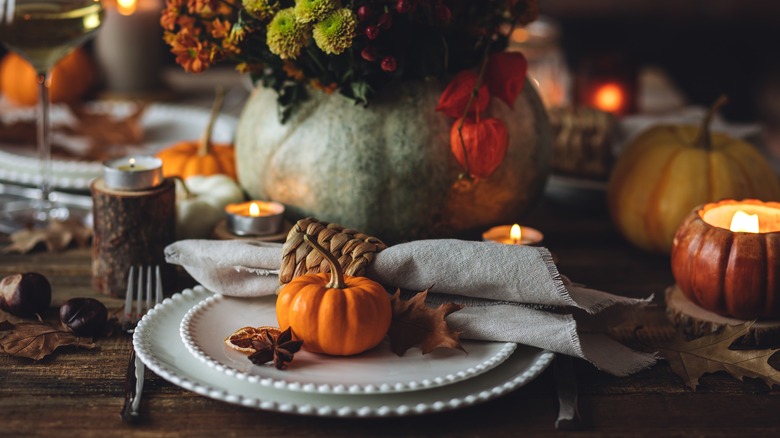 Harvest festival table settings with pumpkin on a plate