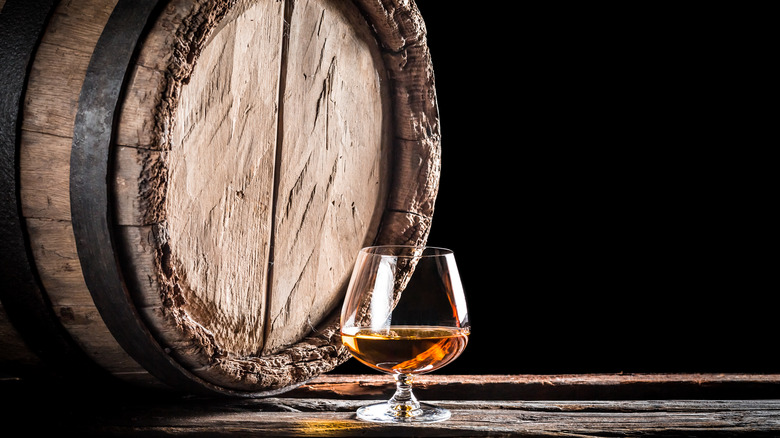 wooden barrel and cognac snifter