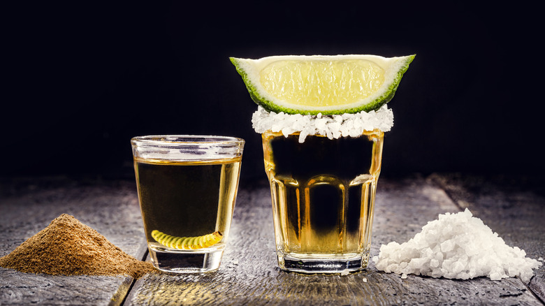 shots of tequila with salted rim and lime