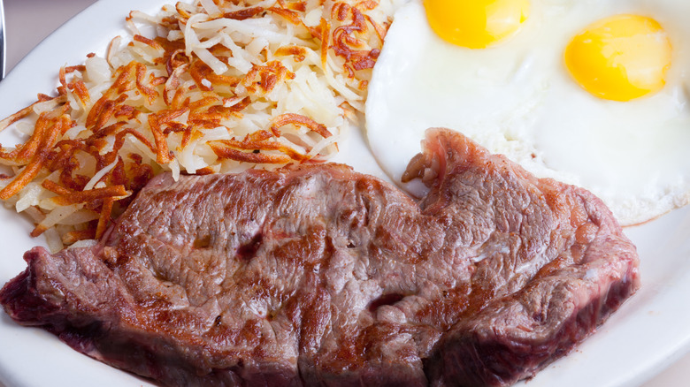 Steak with hash browns and eggs