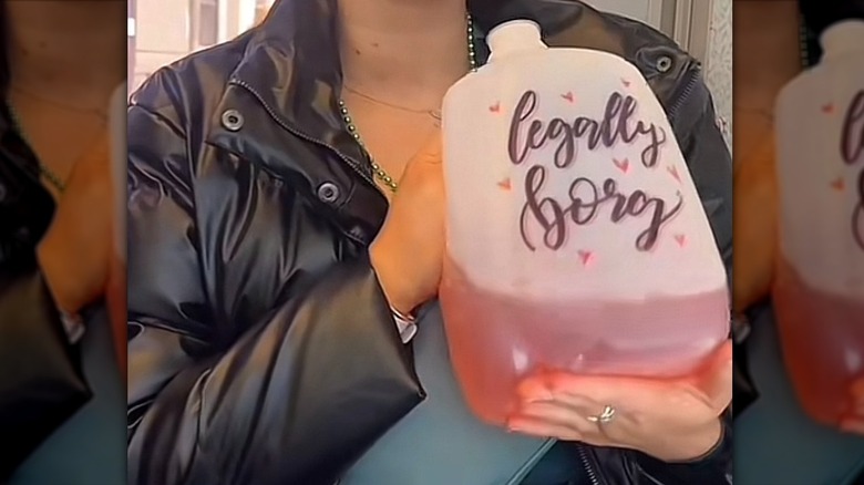 Person holding plastic jug reading "legally borg"