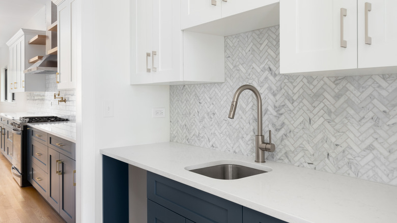 Kitchen scullery with gray backsplash