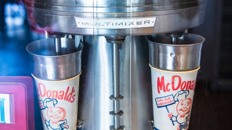 A vintage McDonald's milkshake machine and original cups