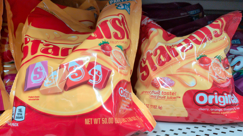 Bags of Starburst on a grocery store shelf