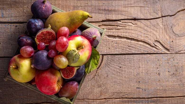 crate of autumnal fruits