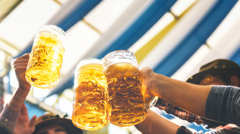 Beers clinking in fest tent