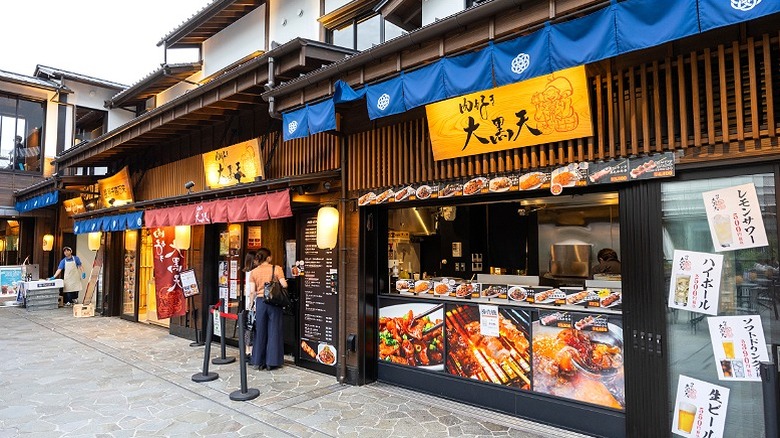 Toyosu shops with seafood menus in front