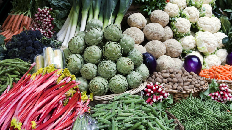 Baskets of fresh produce such as rhubarb and potatoes