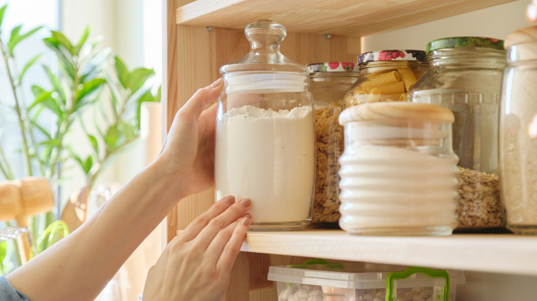 Placing flour in pantry