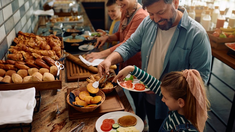 family at breakfast buffet 