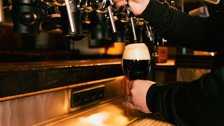 Pouring porter draft in pint